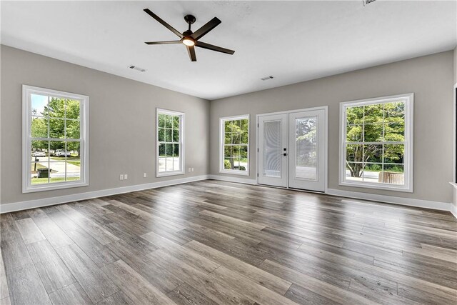 1661 S Camden Ct, Auburn, AL 36830 - unfurnished living room with ceiling fan, wood finished floors, and french doors