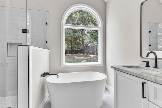 1661 S Camden Ct, Auburn, AL 36830 - full bath featuring a soaking tub, vanity, and a tile shower