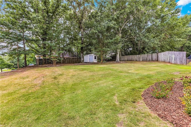 1661 S Camden Ct, Auburn, AL 36830 - fenced backyard featuring a storage unit