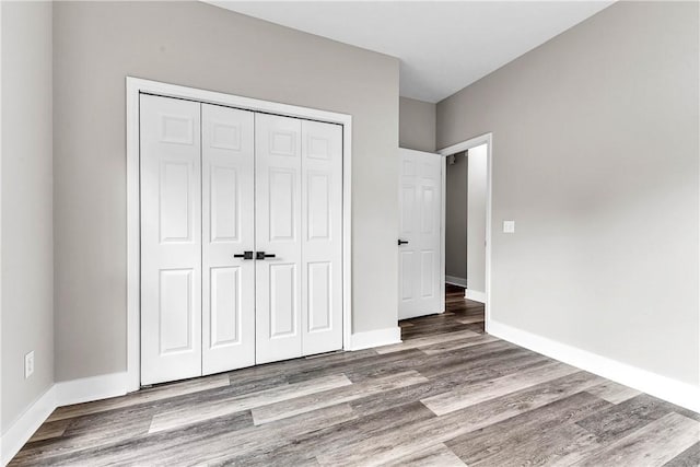 1661 S Camden Ct, Auburn, AL 36830 - unfurnished bedroom with a closet and wood finished floors