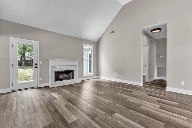 1661 S Camden Ct, Auburn, AL 36830 - unfurnished living room featuring wood finished floors, high vaulted ceiling, and a fireplace