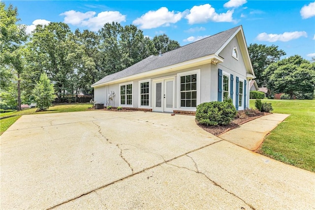 1661 S Camden Ct, Auburn, AL 36830 - view of front facade featuring french doors, a front yard, stucco siding, and roof with shingles