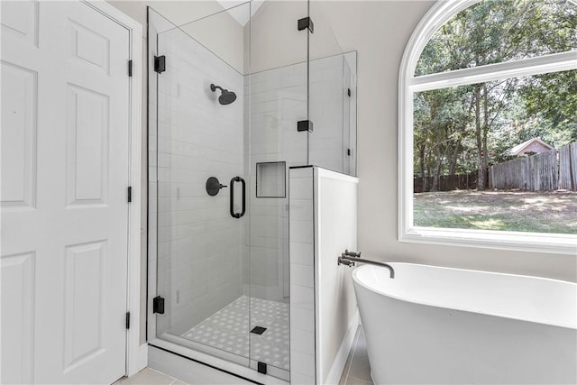 1661 S Camden Ct, Auburn, AL 36830 - bathroom featuring a freestanding tub, a shower stall, and tile patterned flooring