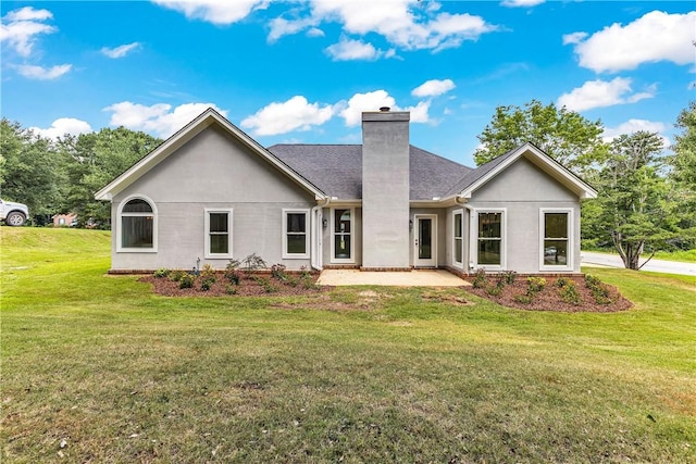 1661 S Camden Ct, Auburn, AL 36830 - back of property with a chimney, a patio, a lawn, and roof with shingles