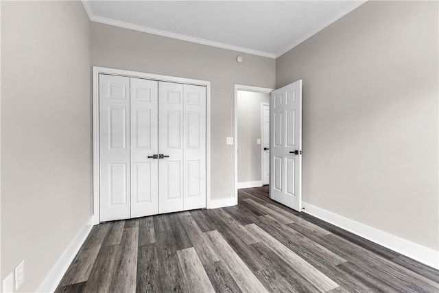 1661 S Camden Ct, Auburn, AL 36830 - unfurnished bedroom with dark wood-style flooring, ornamental molding, and a closet