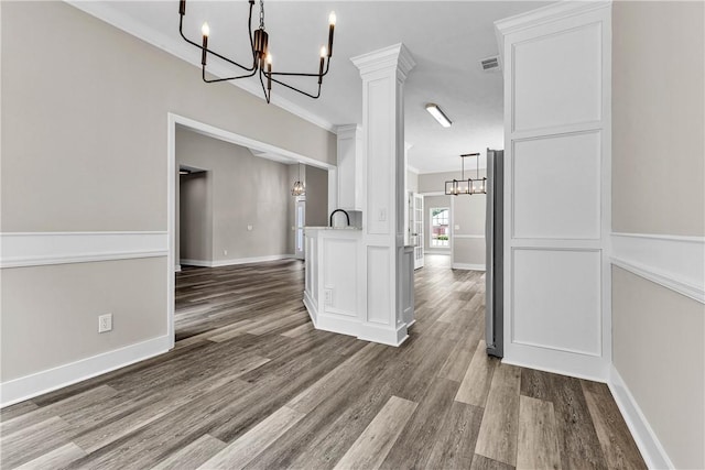 1661 S Camden Ct, Auburn, AL 36830 - unfurnished room with a chandelier, wood finished floors, and crown molding