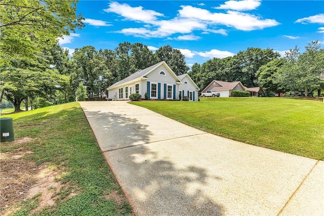 1661 S Camden Ct, Auburn, AL 36830 - view of front of house with concrete driveway, a front yard, and view of scattered trees