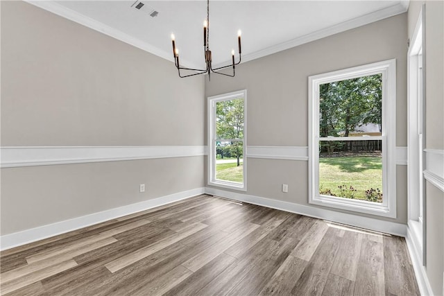 1661 S Camden Ct, Auburn, AL 36830 - unfurnished dining area with a chandelier, wood finished floors, and crown molding