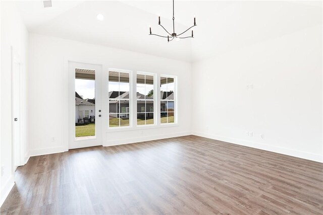 112 Hunters Way, Opelika, AL 36801 - unfurnished dining area featuring a chandelier, wood finished floors, baseboards, and recessed lighting