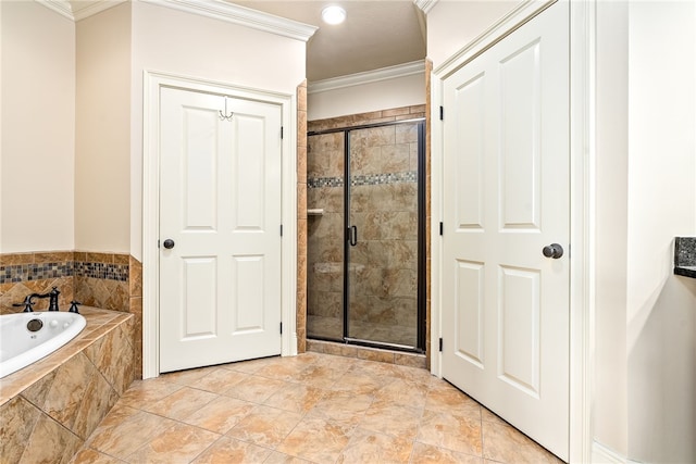 234 W Magnolia Ave Unit 305, Auburn, AL 36830 - bathroom with crown molding, a stall shower, and a bath