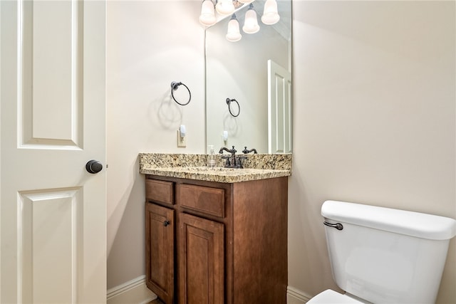 234 W Magnolia Ave Unit 305, Auburn, AL 36830 - bathroom with vanity, toilet, and baseboards