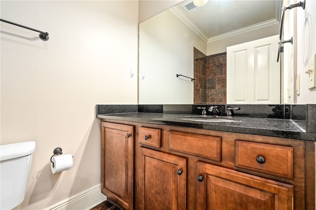 234 W Magnolia Ave Unit 305, Auburn, AL 36830 - bathroom with toilet, ornamental molding, and vanity