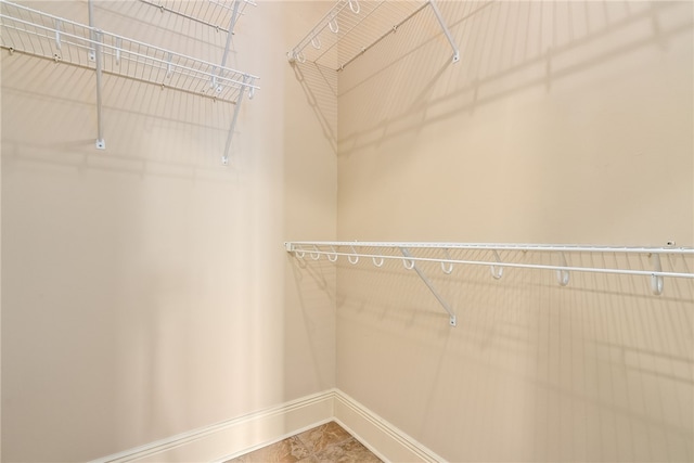 234 W Magnolia Ave Unit 305, Auburn, AL 36830 - walk in closet featuring tile patterned flooring