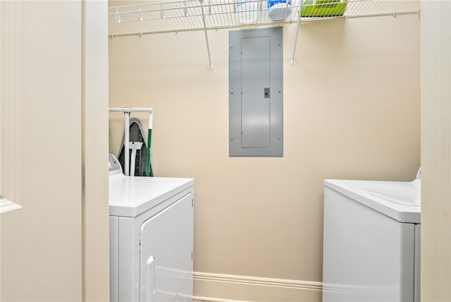 234 W Magnolia Ave Unit 305, Auburn, AL 36830 - washroom with electric panel, washer and clothes dryer, and baseboards