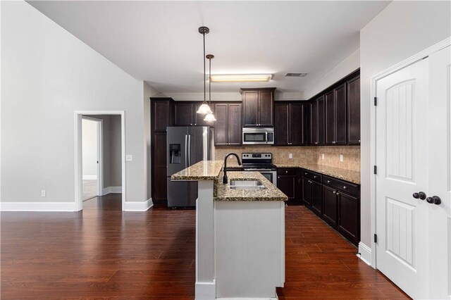 8 Ivy Loop, Phenix City, AL 36867 - kitchen with stainless steel appliances, dark wood-style flooring, decorative backsplash, and light stone countertops