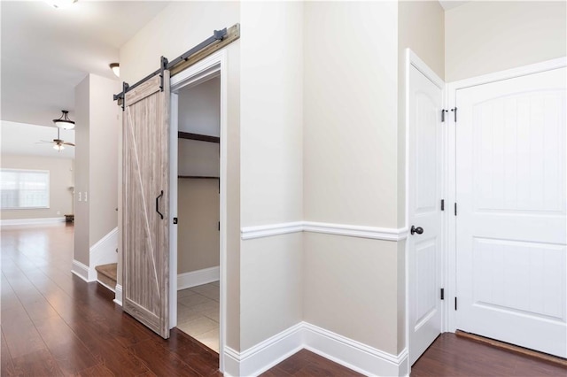 8 Ivy Loop, Phenix City, AL 36867 - corridor featuring wood finished floors, a barn door, and stairway
