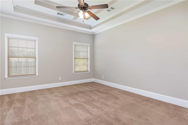 8 Ivy Loop, Phenix City, AL 36867 - empty room featuring a tray ceiling, ornamental molding, carpet floors, and a ceiling fan