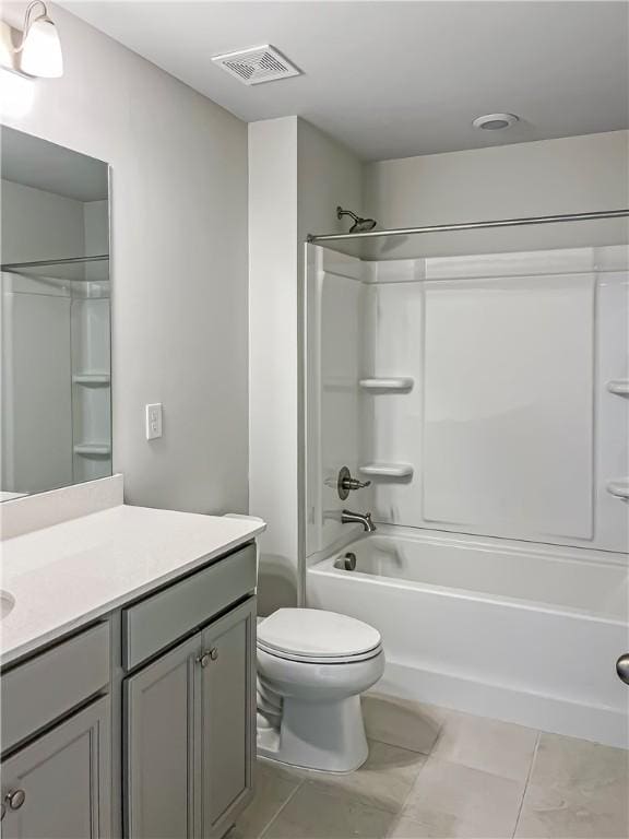 full bathroom featuring bathing tub / shower combination, tile patterned flooring, vanity, and toilet