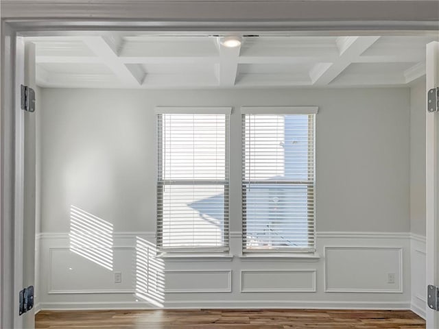 interior space featuring beam ceiling, hardwood / wood-style floors, and coffered ceiling