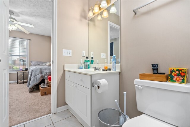 1477 N Donahue Dr Unit 1708, Auburn, AL 36830 - ensuite bathroom featuring vanity, a ceiling fan, tile patterned flooring, and a textured ceiling