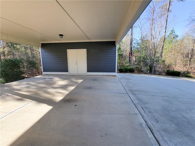 3615 Eagle Nest, Opelika, AL 36801 - view of patio / terrace featuring an attached carport and concrete driveway