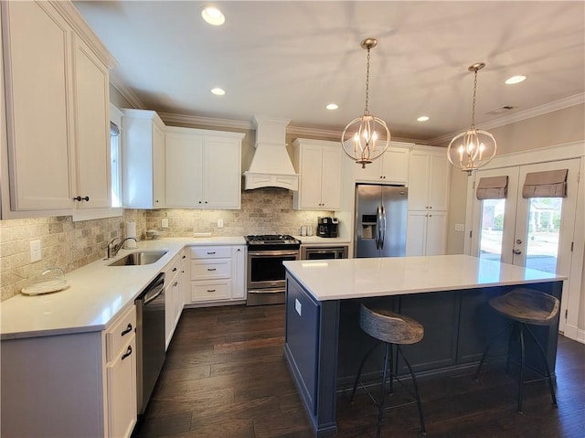 3615 Eagle Nest, Opelika, AL 36801 - kitchen with premium range hood, ornamental molding, a sink, stainless steel appliances, and french doors