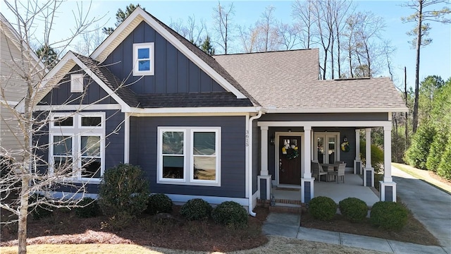 3615 Eagle Nest, Opelika, AL 36801 - view of front of property featuring a porch, board and batten siding, and a shingled roof