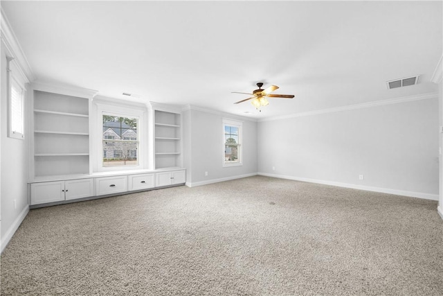 unfurnished living room featuring ornamental molding, carpet, built in features, and ceiling fan