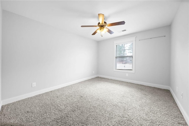 unfurnished room with ceiling fan and carpet floors