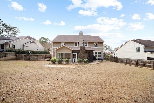 back of property featuring a lawn