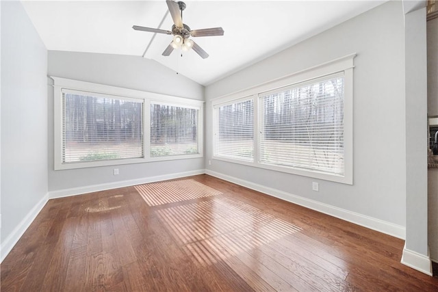 unfurnished room featuring lofted ceiling, hardwood / wood-style floors, a healthy amount of sunlight, and ceiling fan