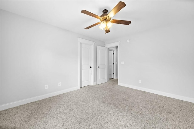 unfurnished room featuring carpet and ceiling fan