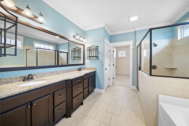 bathroom featuring crown molding, separate shower and tub, vanity, and tile patterned floors