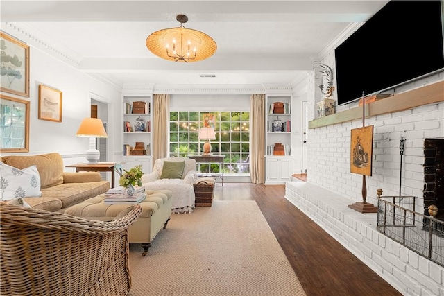 2521 Middle Brook Ln, Auburn, AL 36832 - living area featuring ornamental molding, a brick fireplace, wood finished floors, built in shelves, and a chandelier