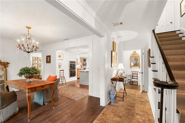 2521 Middle Brook Ln, Auburn, AL 36832 - entryway with stairway, ornamental molding, a chandelier, and wood finished floors