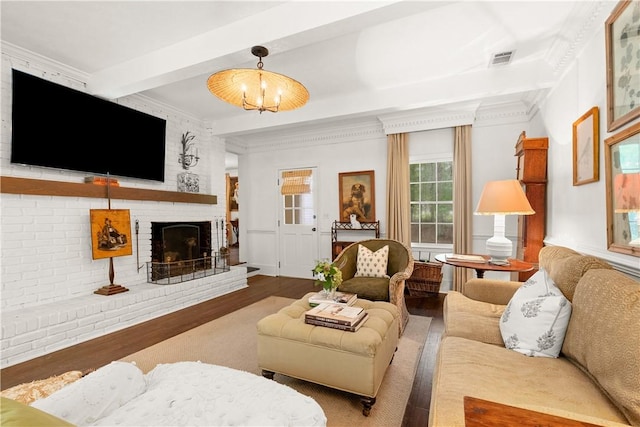 2521 Middle Brook Ln, Auburn, AL 36832 - living area featuring wood finished floors, ornamental molding, a brick fireplace, and beamed ceiling