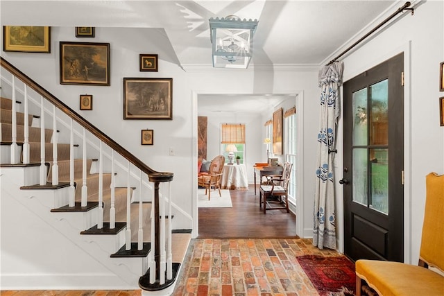 2521 Middle Brook Ln, Auburn, AL 36832 - entrance foyer with brick floors, stairway, and crown molding