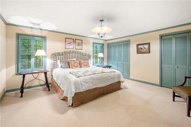 2521 Middle Brook Ln, Auburn, AL 36832 - bedroom with carpet, crown molding, two closets, multiple windows, and a chandelier