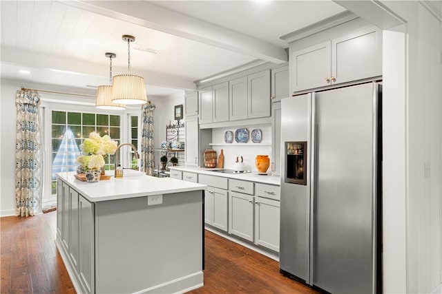 2521 Middle Brook Ln, Auburn, AL 36832 - kitchen featuring stainless steel fridge with ice dispenser, beamed ceiling, dark wood-type flooring, light countertops, and a center island with sink