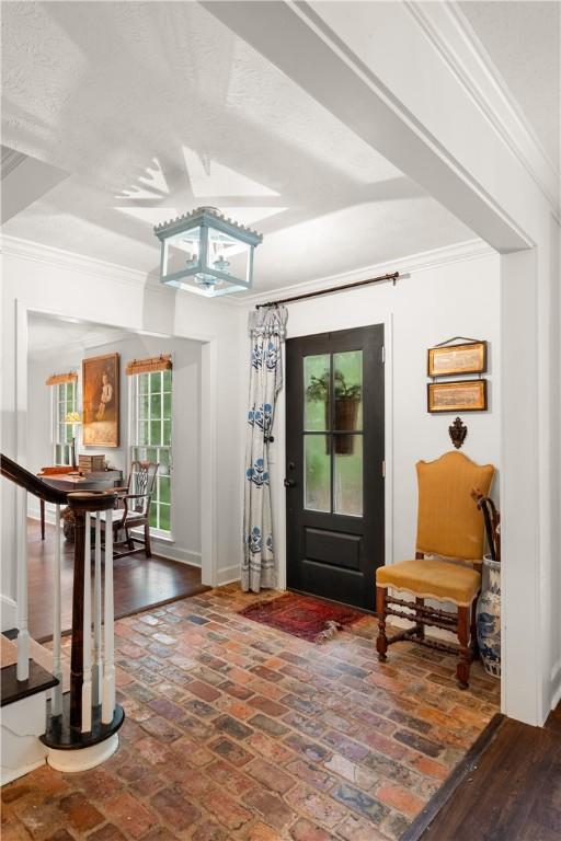 2521 Middle Brook Ln, Auburn, AL 36832 - entryway with ornamental molding and brick flooring