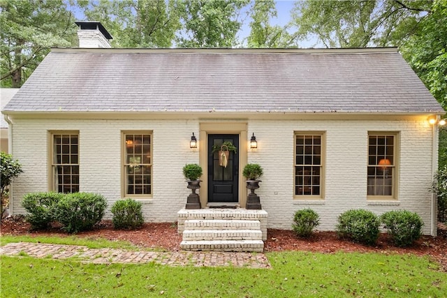 2521 Middle Brook Ln, Auburn, AL 36832 - view of front of property featuring a chimney, brick siding, and a front yard
