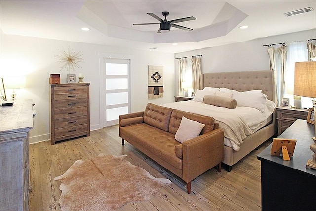 3897 Moores Mill Rd, Auburn, AL 36830 - bedroom featuring a raised ceiling, light wood-style floors, ceiling fan, and recessed lighting