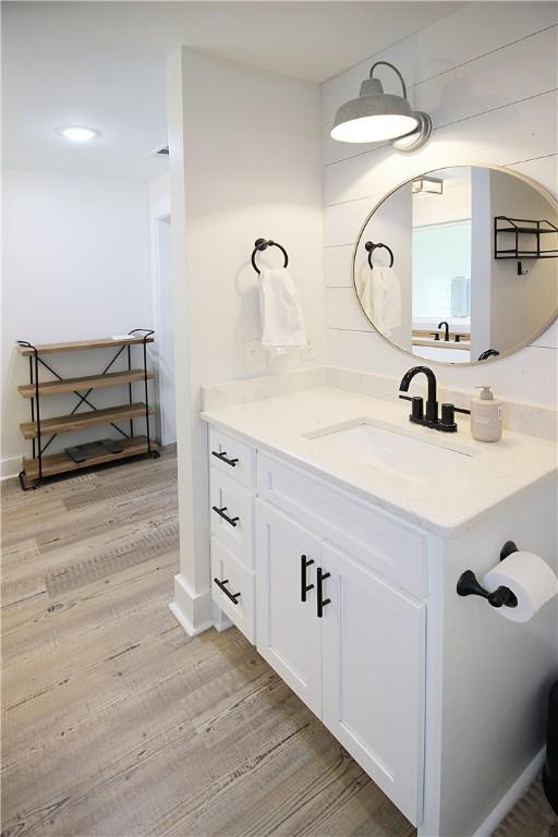 3897 Moores Mill Rd, Auburn, AL 36830 - bathroom featuring wood finished floors and vanity