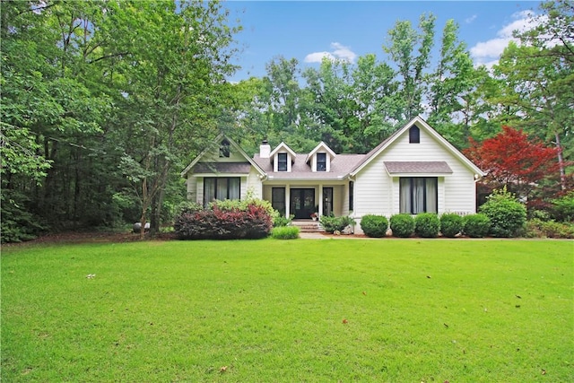 3897 Moores Mill Rd, Auburn, AL 36830 - cape cod home with a front lawn and a chimney