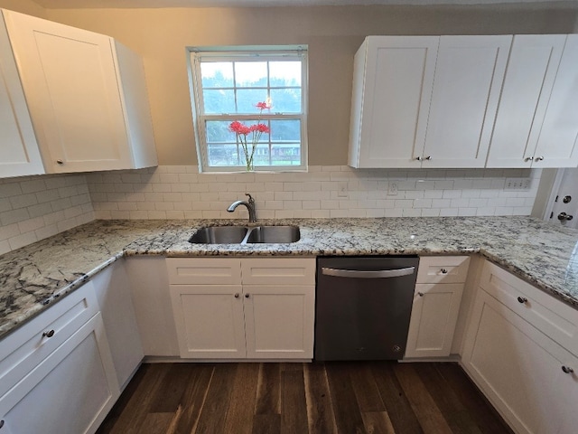 kitchen featuring white cabinetry, sink, dishwasher, dark hardwood / wood-style floors, and decorative backsplash