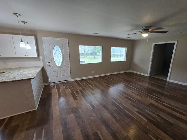 foyer featuring dark hardwood / wood-style flooring and ceiling fan