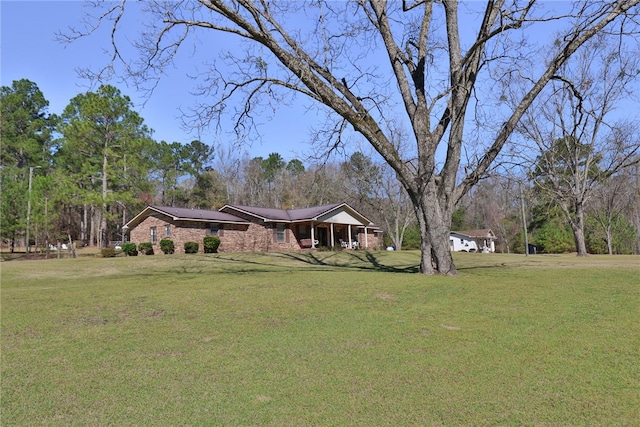 2071 County Road 63, Tuskegee, AL 36083 - view of front facade with a front yard and brick siding