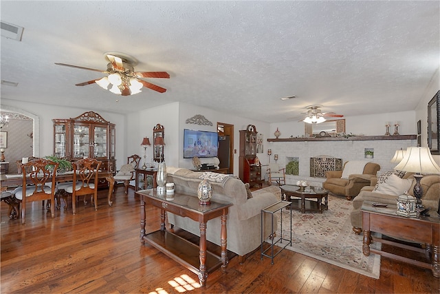 2071 County Road 63, Tuskegee, AL 36083 - living area with ceiling fan, wood-type flooring, and a textured ceiling