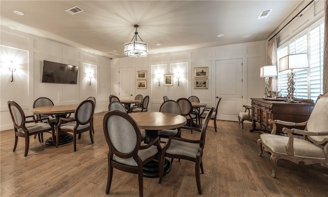 dining area with dark hardwood / wood-style flooring
