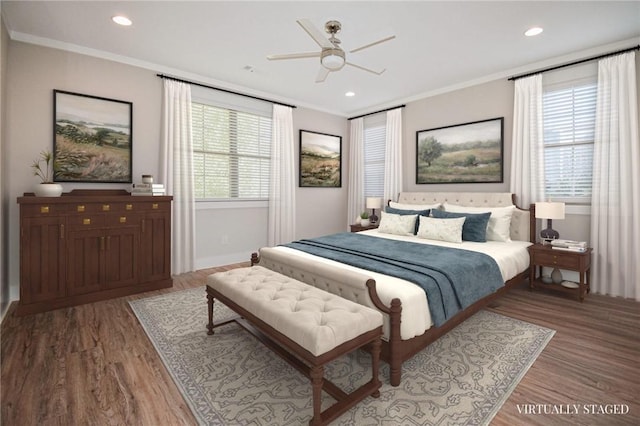 bedroom with multiple windows, ornamental molding, and hardwood / wood-style floors